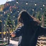 young-woman-is-dancing-against-backdrop-mountains_169016-25218